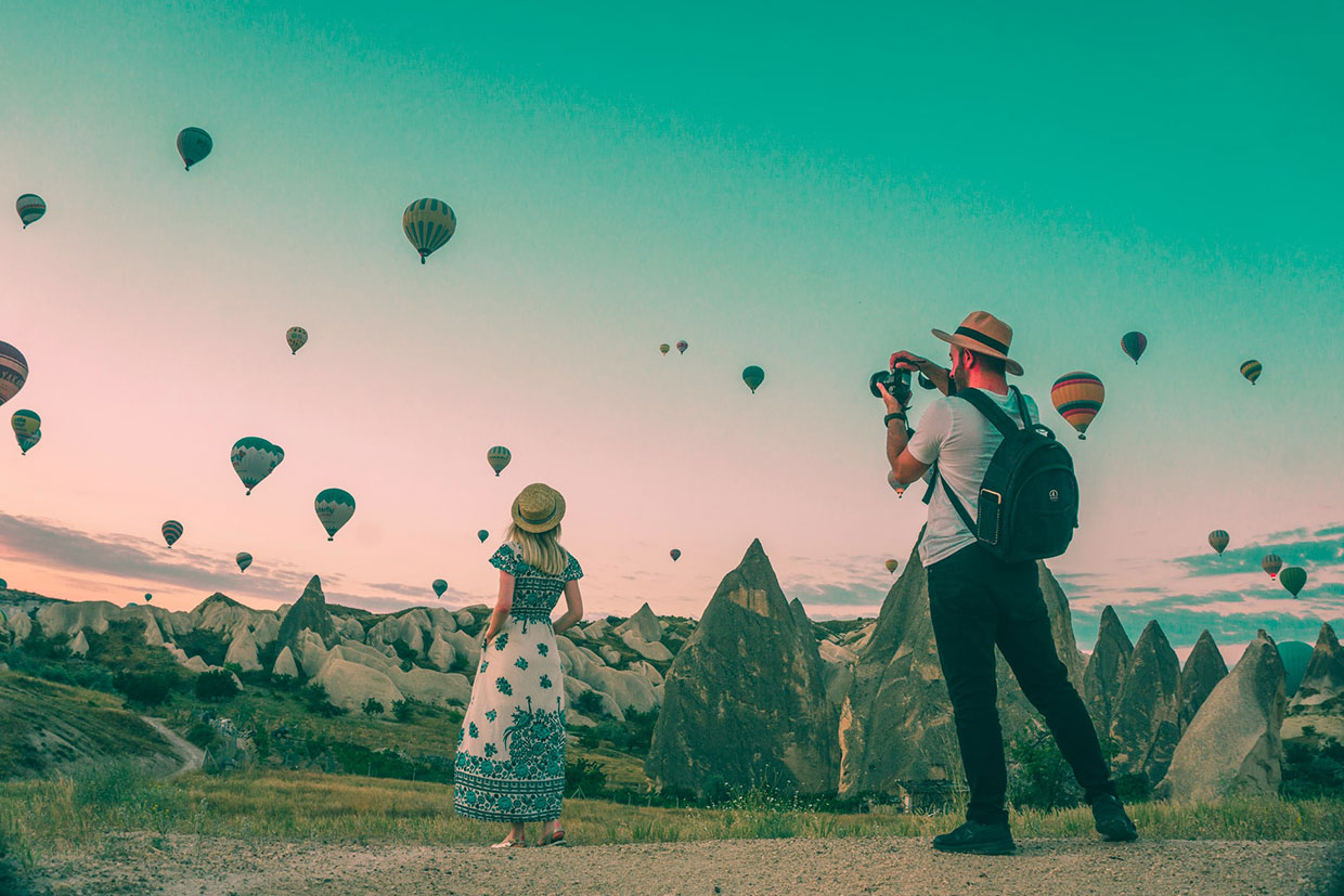Quisque faucibus laoreet eros vel 1 Man taking photo of hot air balloons